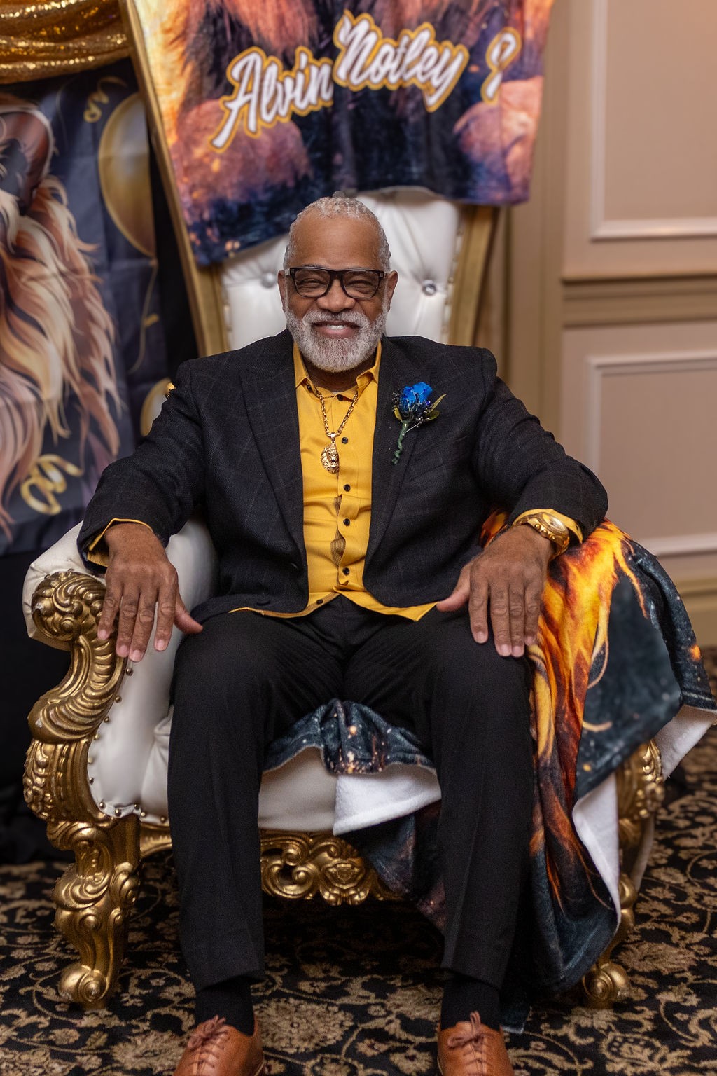 Pastor Motley smiling in his birthday chair