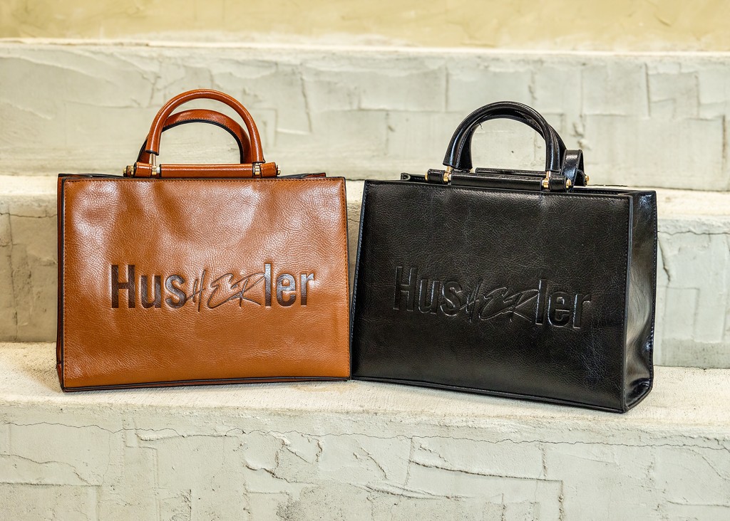 Brown and black handbags displayed together